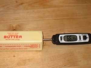 Testing butter temperature with thermometer